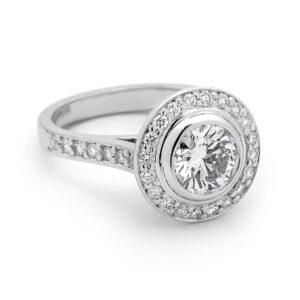 round brilliant diamond bezel set centre, pave halo ring by Stelios Jewellers in Perth