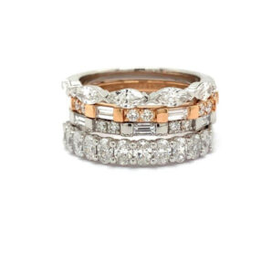 4 wedding rings with diamonds stacked together